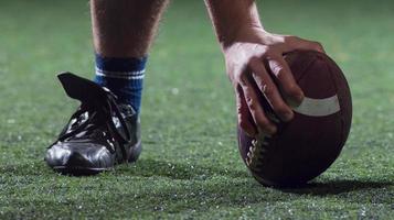 American football player starting football game photo