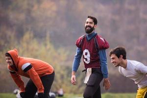 american football players stretching and warming up photo