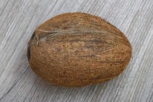 Cocount on wooden background photo