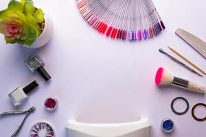 Top view of manicure and pedicure equipment on white background photo