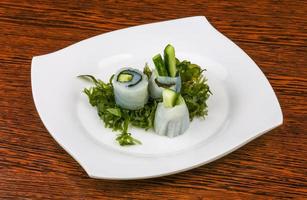 Squid sashimi on the plate and wooden background photo