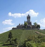 The castle Reichsburg Cochem on top of a hill in the city of Cochem, Germany photo