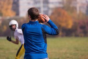 american football team with coach in action photo