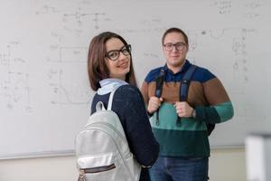 portrait of young students in front of chalkboard photo