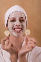 Spa Woman applying Facial Mask photo