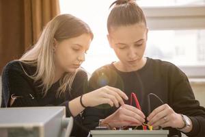 students doing practice in the electronic classroom photo