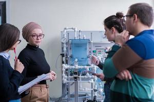 young students doing practice in the electronic classroom photo