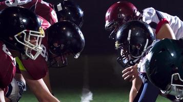 american football players are ready to start photo