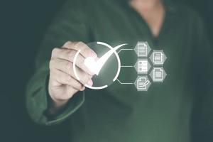 Online document approval concept. Man's hand using a pen. Sign the approval on the touch green screen to be forwarded to the document storage system Through the Internet and forwarding photo