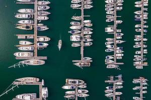 Aerial top down view of mamny leisure boats and yachts moored in marina in Cascais, Portugal photo