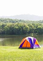 Dome tent camping at lake side photo