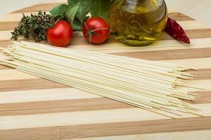 Egg spaghetti on wooden background photo