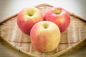 Red apple in basket photo