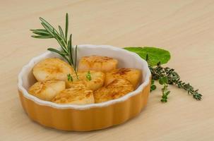 Grilled scallops in a bowl on wooden background photo