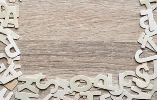 Top view ABC alphabet on wood background photo