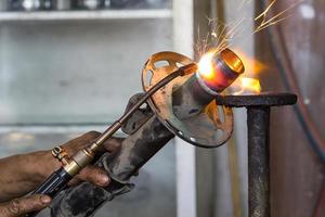 Welders were repairing Shock absorbers photo