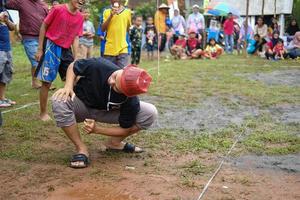 Blitar, Indonesia - September 11th 2022 Enthusiastic teenage boys take part in a competition to commemorate Indonesian Independence Day in Blitar in the afternoon photo