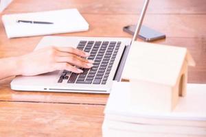 A young business woman using laptop computer. photo