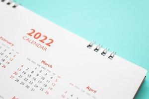 2022 calendar page on blue background business planning appointment meeting concept photo