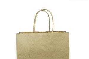 Brown recycled paper bag with colored handles on a white background. photo