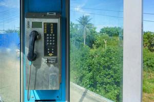 Old coin operated telephone booths located in rural areas of Thailand cannot be used. photo