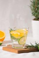 Fresh summer lemonade with citrus, orange and rosemary photo