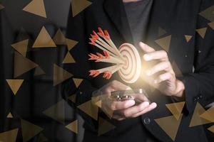 Darts target. Success Business Concept. Target hit in center by arrows, future technology Success Business Concept Target hit in center by arrow Darts target. Success Business Concept photo