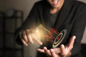 Darts target. Success Business Concept. Target hit in center by arrows, future technology Success Business Concept Target hit in center by arrow Darts target. Success Business Concept photo