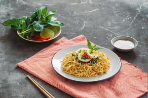 Dry instant noodle - asian ramen and vegetables for the soup photo