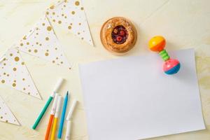 Party management and organization concept with sweets, confetti and blank pages. Creative celebration flat lay with copy space. photo