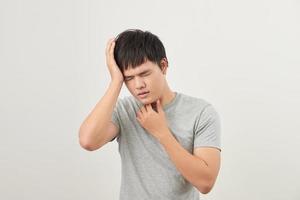 sick man has a sore throat isolated on a white background photo