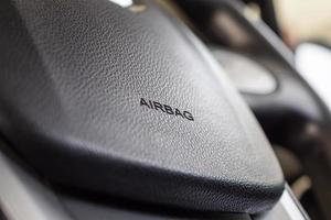 Safety airbag sign on car steering wheel photo