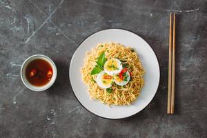 Dry instant noodle - asian ramen and vegetables for the soup photo