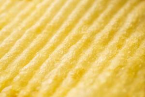 Potato chip texture background closeup photo