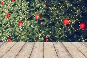 Christmas holiday background with empty wooden table photo