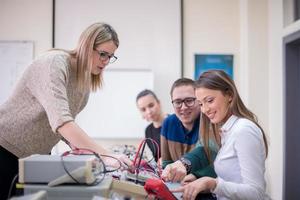 students doing practice in the electronic classroom photo