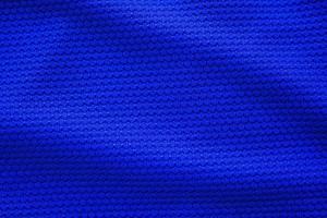 Camiseta de fútbol azul ropa textura de tela ropa deportiva fondo, vista superior de primer plano foto