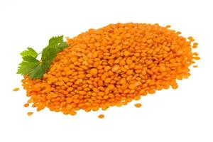 Red lentils on white photo