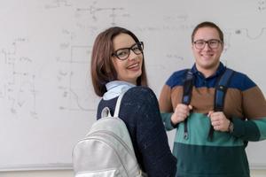 portrait of young students in front of chalkboard photo