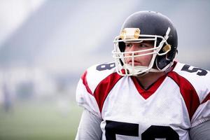 portrait of young confident American football player photo