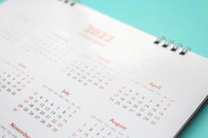 2022 calendar page on blue background business planning appointment meeting concept photo