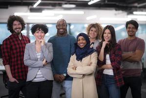 portrait of young excited multiethnics business team photo