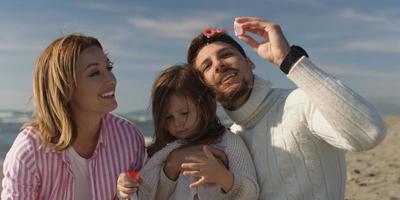 Young family enjoying vecation during autumn photo