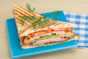 Club sandwich on wooden background photo