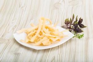 Dried squids on the plate and wooden background photo