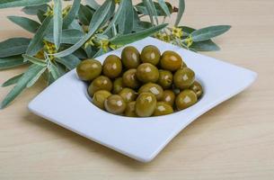 Green olives dish photo