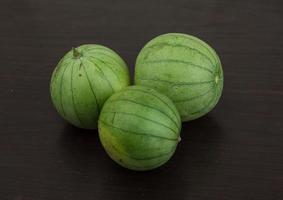 Asian eggplant on wood photo