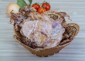 Dried squid on wood photo