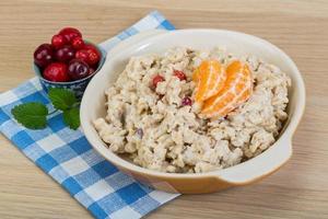 Oatmeal on wood photo