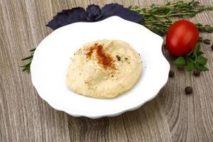 Hummus in dish photo